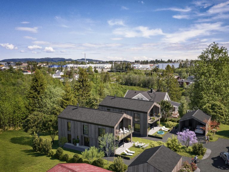 et luftfoto av et boligområde med hus og trær.