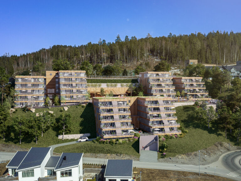 en luftfoto av et leilighetskompleks i en åsside.